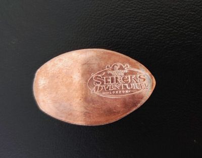 Souvenirmunt – motief van muntautomaat Drachenzähmen im Shrek Shop (SE1 7PB Groß-London)